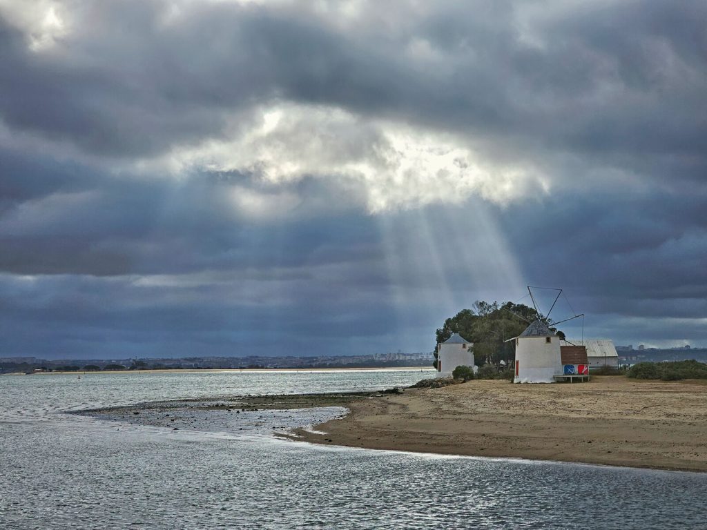 Godrays falling on a house on the beach