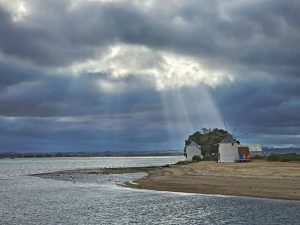 Godrays falling on a house on the beach